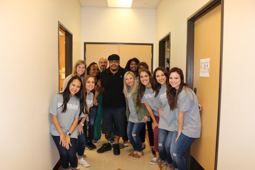 Marquell with Aggies for Limbs members at the clinic